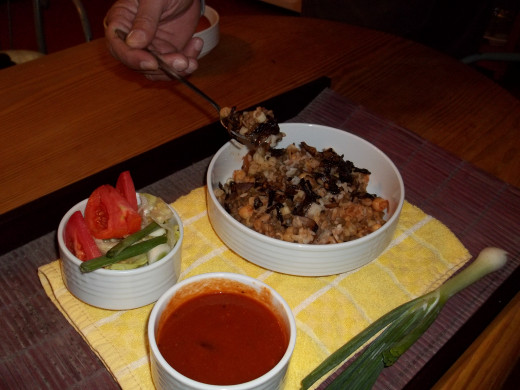 Irresistible Koshary seved with hot chilli sauce and salad—ideal on a cold day.
