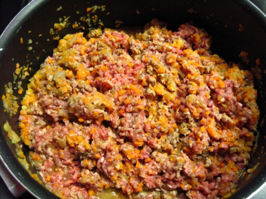 Add the ground meat, stirring well and braking any meat lumps,