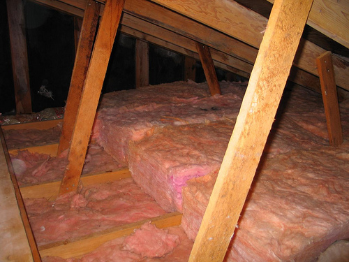 Adding insulation between the floor joists to achieve a higher R-Value.