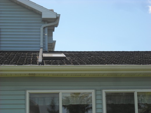 Curling roof shingles indicate that the shingles need to be replaced.