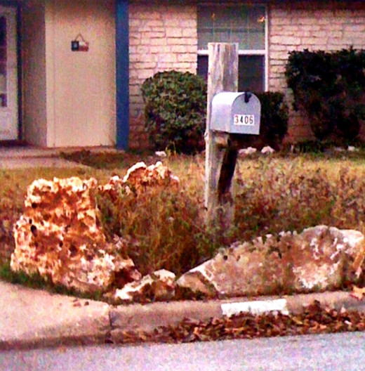 Stones surround a mailbox