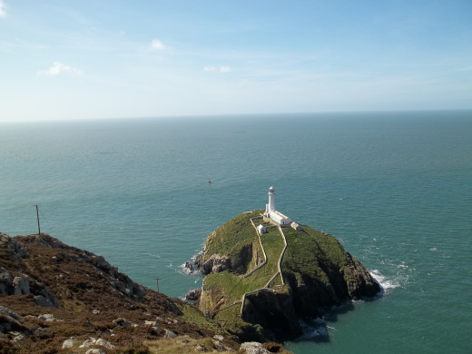 South Stack Cliffs Lighthouse, Anglesey, Wales, UK.  A wonderful walk down the cliff steps from the bird sanctuary, down to the lighthouse where visitors are made welcome and can climb yet more steps!
