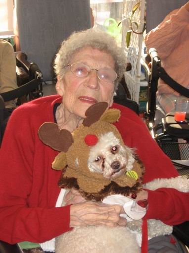 Mom with Romeo -  the Reindeer Poodle -  at the nursing home last Christmas.  
