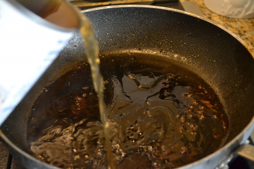 Leave the meat drippings and leftover oil in the pan, then pour in a can of beef broth.