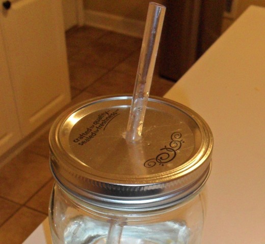 Use a drill or hammer and nail to cut through the lid. You'll have to file the rough edges smooth.