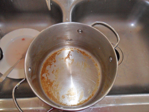 The pot soaked overnight and then I scoured. Still the bottom wouldn't come clean.