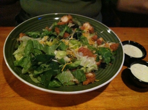 Chicken Salad at Applebees. Since their salads are so large, I always ask for a to-go box and immediately put half away for lunch the next day. Also forgo using both cups of salad dressing. It is soooo bad for you.