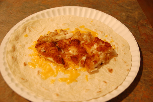 Chicken strip tortilla wrap with shredded cheddar