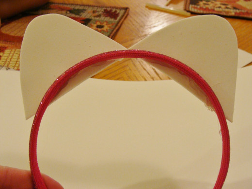 Be sure to glue the ears to the back of the headband.