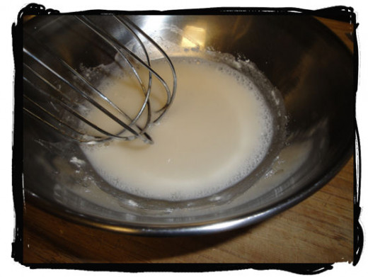 Mix flour and cold water with a whisk, prior to adding heat. Mix well to remove all of the lumps.