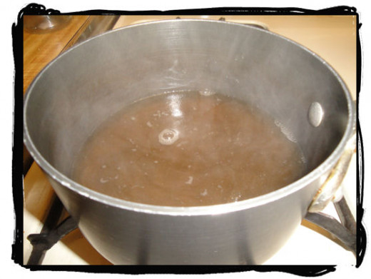 Simmering bouillon and water, mix good prior to adding cold flour and water mixture