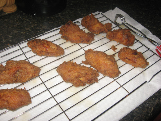 Fried Wings will stay crispy if you drain them on wire racks. 
