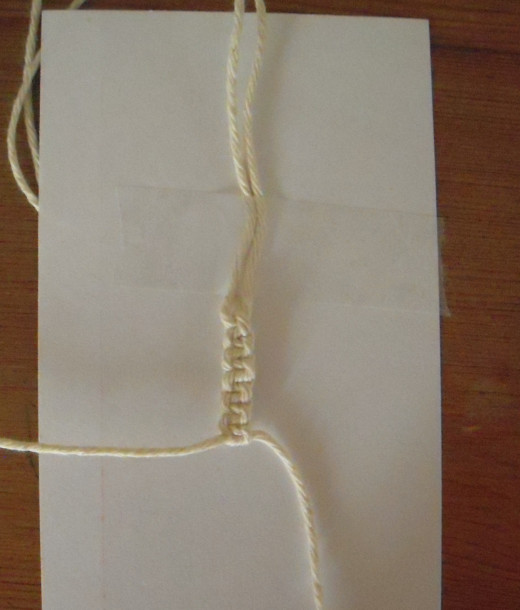 Continue tying square knots to build the bracelet.  