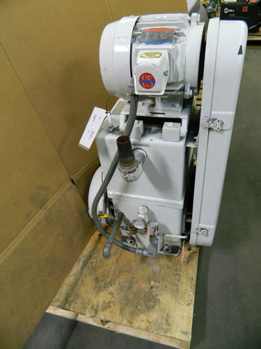 yes, mechanical pumps are often mounted like this. On a board or dolly for mobility.  Sometimes wood  sometimes metal.  Often connected with flexible vacuum hoses.  All this equipment must be removable... WHILE a particle accelerator remains operable