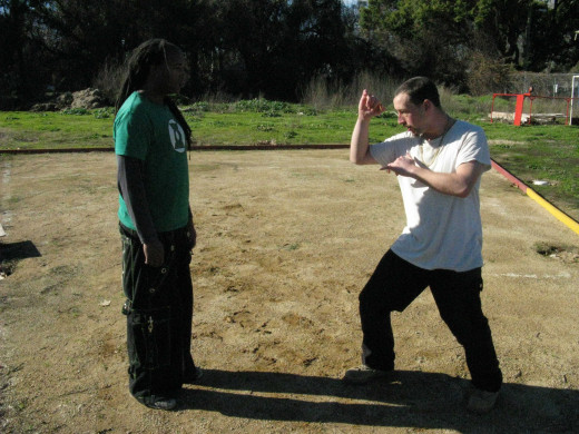 Glenn and Jamie demonstrate a Kenpo technique called Buckling Branch, against a Left Front Thrust Kick