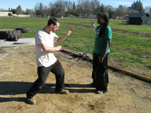 Jamie and Glenn demonstrate a Kenpo technique called Gathering Clouds.