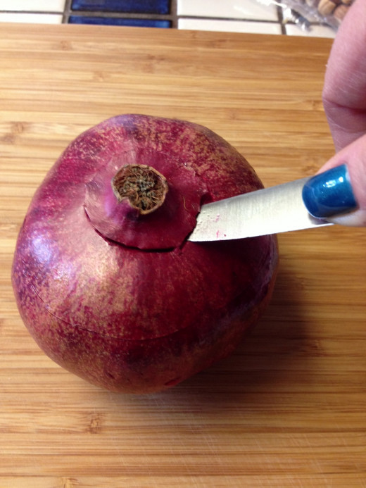 Use the tip of your knife to cut in toward the middle and core out the center crown
