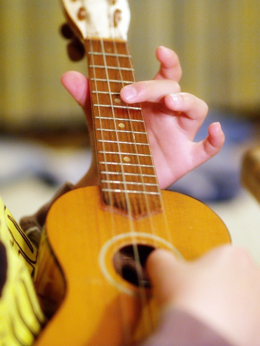 Give new life to an old ukulele by re-stringing it with new, fresh strings.