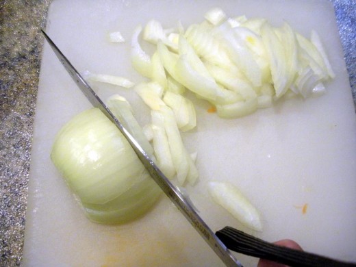Half, then slice onion vertically into slabs, finally, turn and slice into half-rings