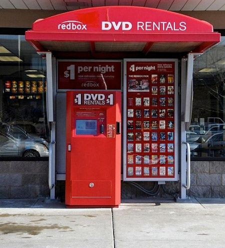 This is a Redbox Kiosk that stores DVDs within itself. They have many kiosk locations now throughout the U.S. both inside or outside companies such as Walmart, CVS, supermarkets, and even gas stations.
