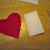 Draw a design and cut it out of contrasting felt (the i in this case), making sure it is sized to fit the front/smallest piece. Draw a design and cut it out of contrasting felt (the i in this case), making sure it is sized to fit the front/smallest piece.