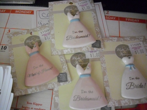 You can find bridal party pins for little money in the wedding section of most stores.