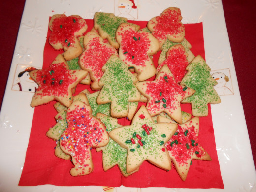 Christmas cookies in the shape of Santas, stars and Christmas trees.