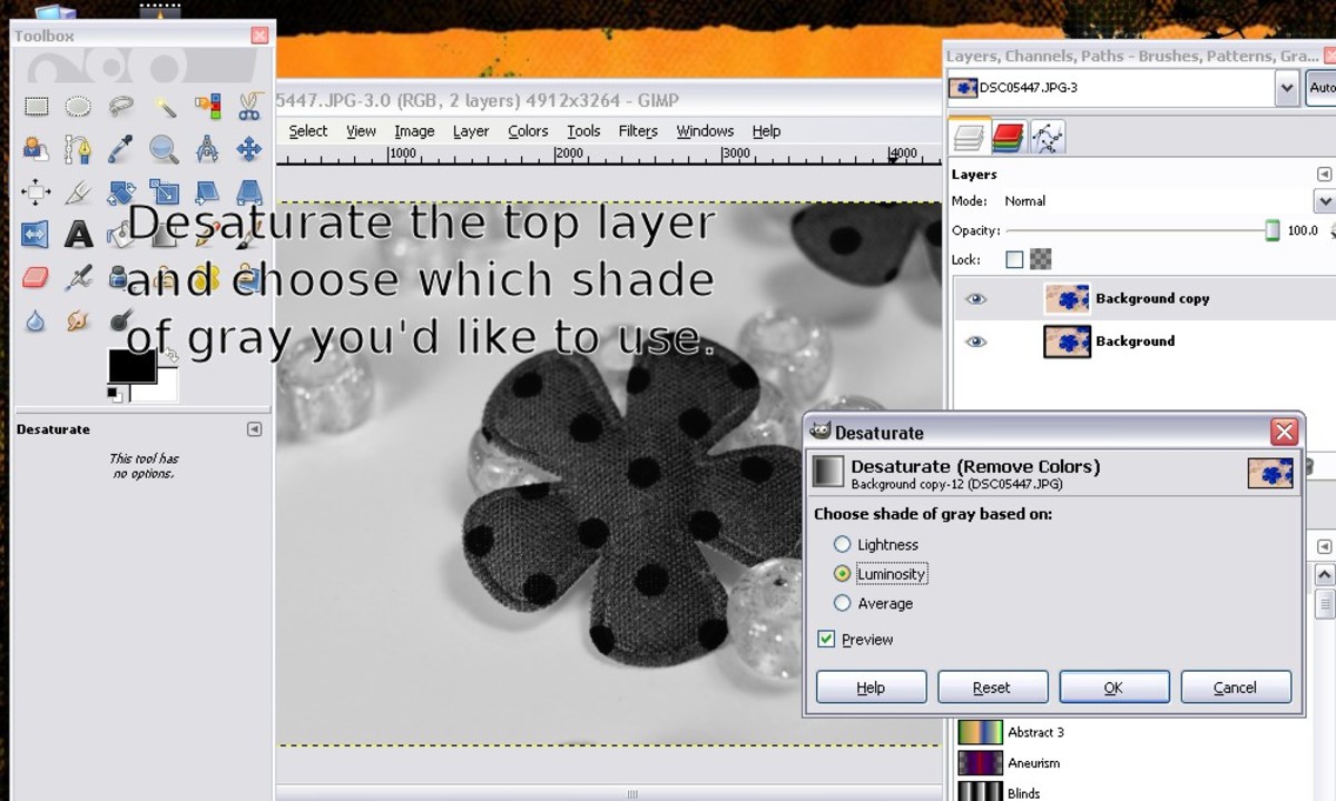 Then you need to desaturate the top layer.  Go to "colors" then to "desaturate" and select which type you want.