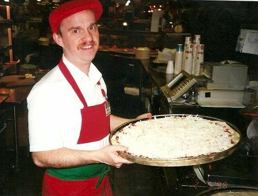 This is a photo of me at work, making gourmet pizza at a former employer.  This is a job I had for over 8 years, and I learned how to make many different kinds of pizza. I was told by many of my customers that I made the best pizzas they ever had!   