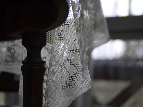 Ethereal lace is a nod to the past in a modern  dining room.