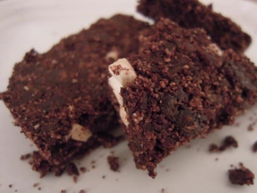 Raw brownie with added chopped nuts