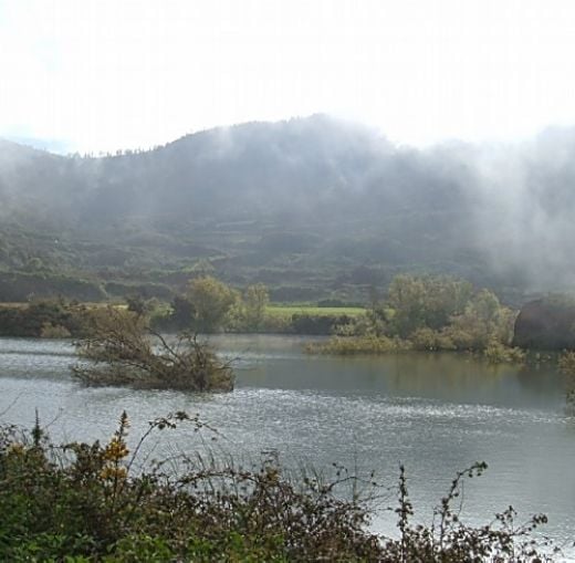 One of the ponds of Erjos with mist rising over the water