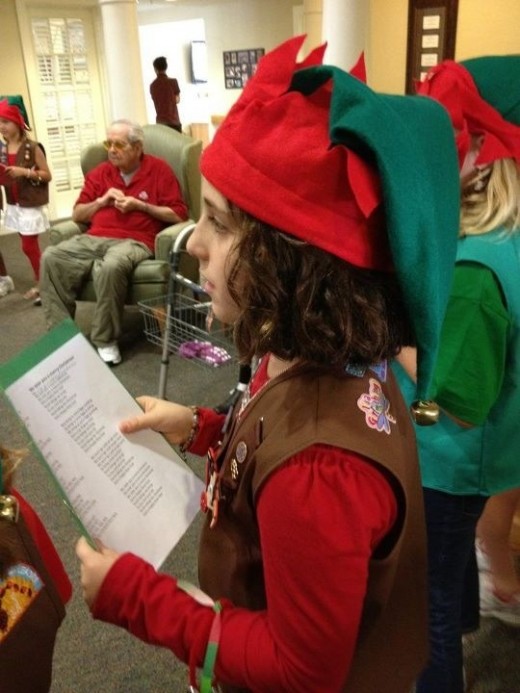 Caroling at a nursing home with Brownies.