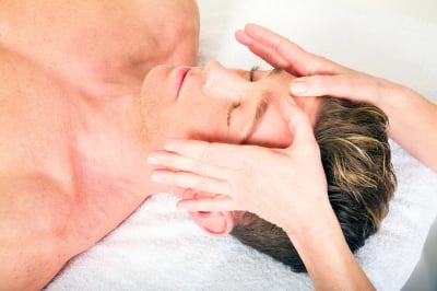 Giving a facial massage to others is best done working from behind your client as in the photograph.