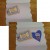 Choose elements for your design and begin adding embellishments. Be sure to write your message before glueing that part of your design to the wrapper. Choose elements for your design and begin adding embellishments. Be sure to write your message before glueing that part of your design to the wrapper.