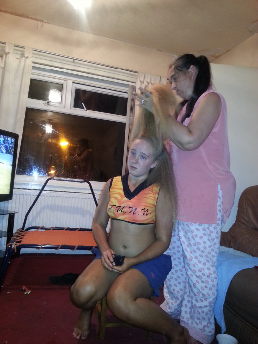 Jennifer and her phone are inseperable, even when having her hair done she has it in hand.