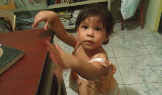 Photo of a fast moving one-year old taken in my office without a flash.
