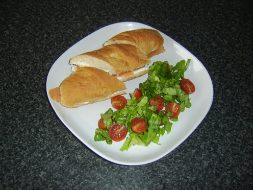 Pickled cucumber, smoked salmon and cream cheese sub served with a simple salad