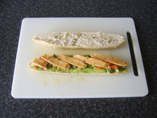 Mexicana cheese slices are laid on the avocado and cucumber salsa