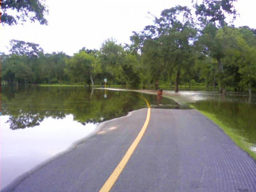 Flooding covers roadways, making them impassible.
