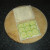 Cucumber slices are laid on one slice of the buttered bread