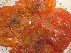 Sliced tomatoes with ground basil
