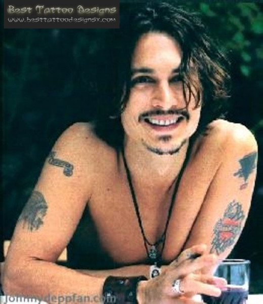 A happy Depp with some cool urban tattoos