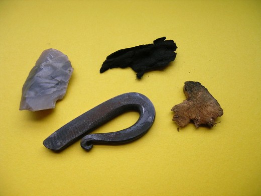 From left to right, a piece of flint, fire striker (bottom), charred cloth (top) and a piece of mushroom were all essential parts of a fire-lighting kit possessed by our ancestors.