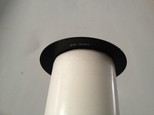 A piece of 2" PVC pipe with filter adapter attached... Slides over your current zoom lens