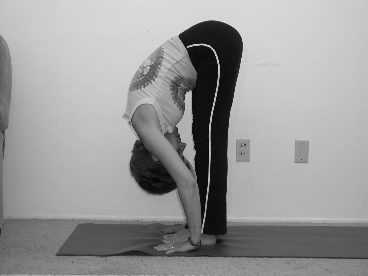 Forward Bend (above) and Half Forward Bend yoga poses are beneficial in stretching the entire back and neck.