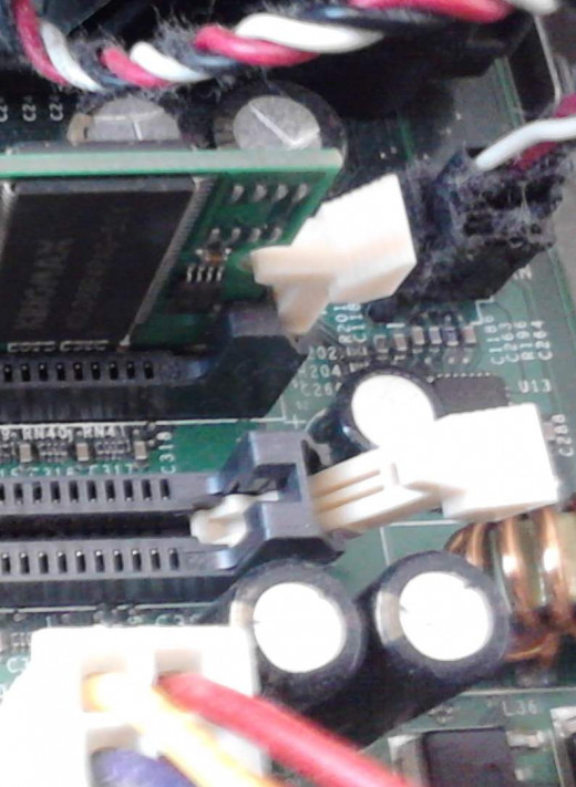 Memory slots with levers; one is opened - the empty slot, and the other is closed over the memory module