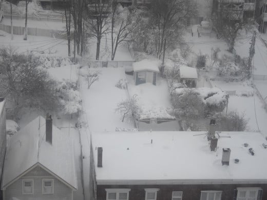 The roof and a view of someone's snow-covered yard