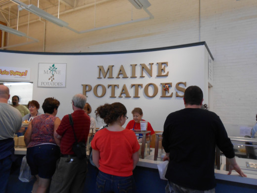 The line for the Maine baked potatoes inside the Maine Building.