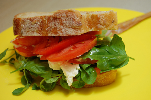 Use basil and other leafy herbs to liven up a tomato sandwich. (CC BY-SA 2.0)